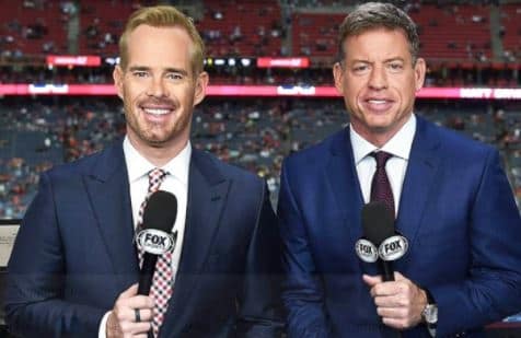Ann Buck's estranged husband, Joe Buck with his co-anchor of Fox Sports. How much is Buck's net worth?